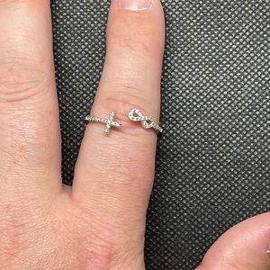 This is a silver plated ring. It is a size 10 but is obviously able to adjust